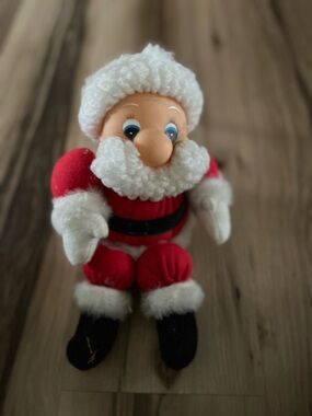 Santa Claus Rubber Face Sitting Dol